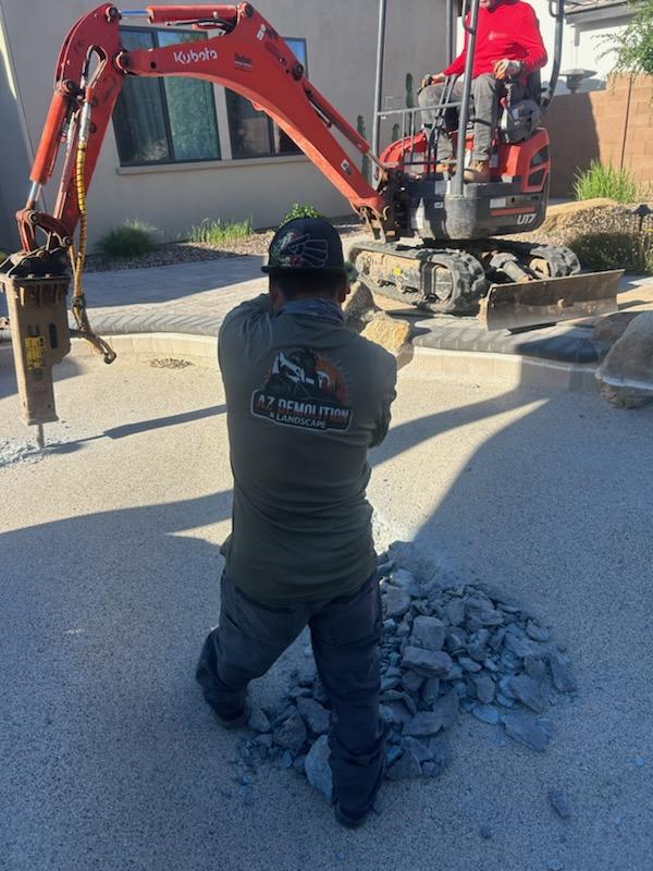 Worker wearing custom branded apparel on a demolition job site