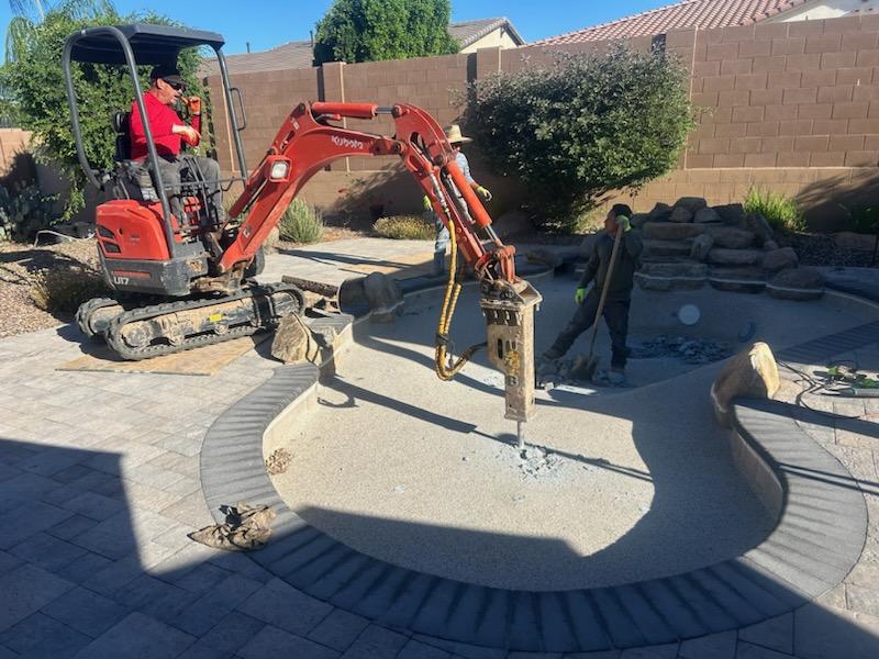 Demolition crew working while wearing branded apparel